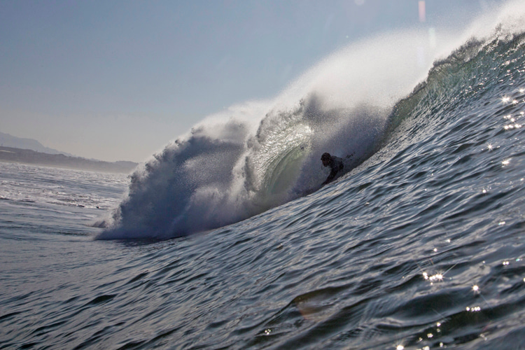 Eric Gustafson: adjusting his body for another barrel | Photo: Sachi Cunningham
