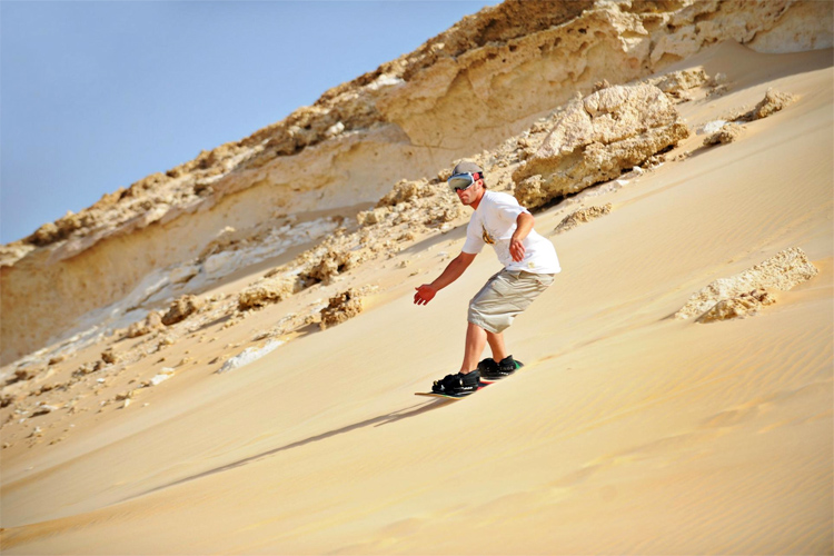 Sandboarding at Great Sand Sea, Egypt | Photo: Egypt Tourism Authority