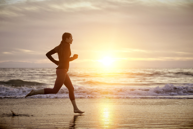 Outdoor life: running along the beach or surfing encourages you to point your attention outward at the world instead of inward | Photo: Shutterstock