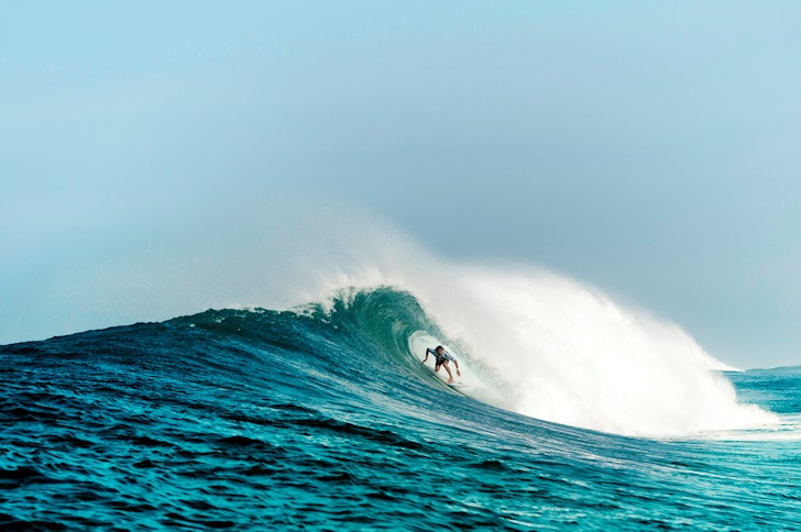 Getting barreled: staying centered is critical to tube-riding | Photo: Quiksilver/Rabejac
