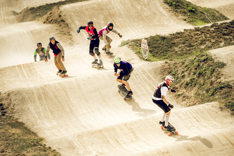 Longboard racing: skaters compete on a BMX-style racetrack to see who gets around the course the fastest | Photo: Red Bull