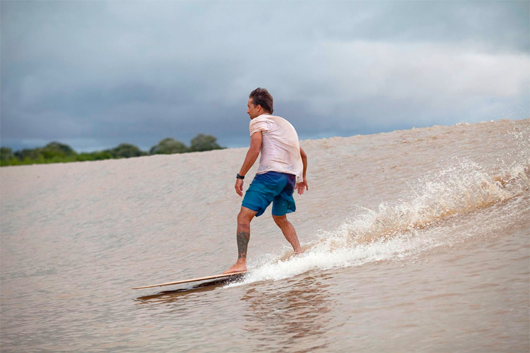 Serginho Laus: the Brazilian surfers rides an alaia board at Pororoca, Brazil | Photo: Laus Archive