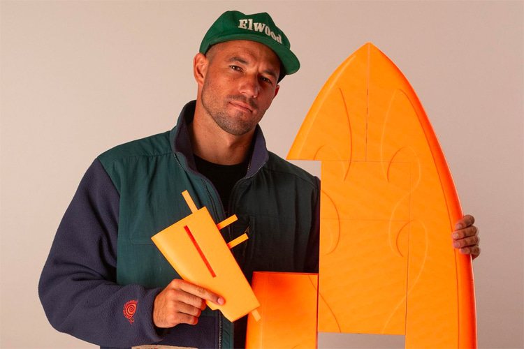 Tanner Waite: holding one of the 23 pieces of his homemade 3D-printed surfboard | Photo: Beach Cowboy