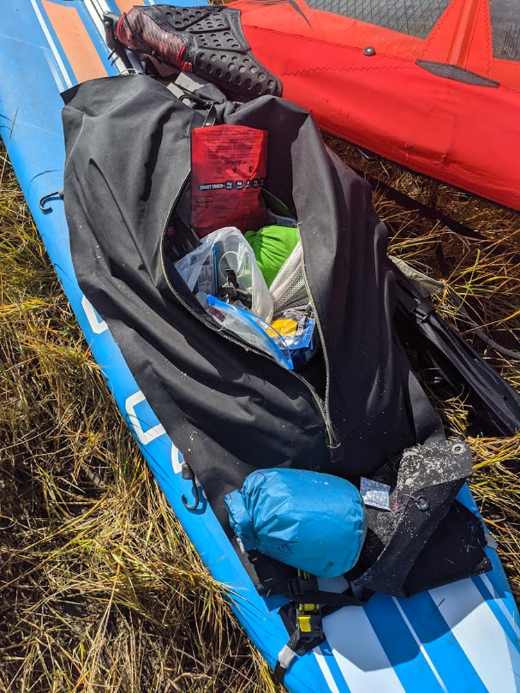 Gear, food and drinks: a windsurfing marathoner's backpack | Photo: Vandenberg